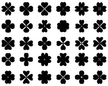 Beyaz arkaplanda dört yapraklı yonca siluetleri