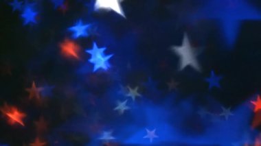 Americana Star Flow Two 4k Loop, soyut bir kompozit döngü içinde ekranda yüzen çeşitli boyutlarda kırmızı, beyaz ve mavi yıldızlara sahiptir