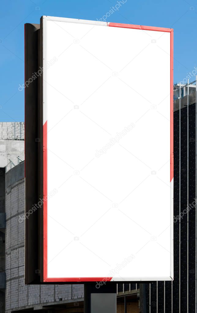 Blank vertical billboard on direct sunlight. Background for mock-up.