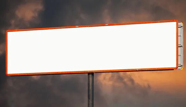 Ultra-wide blank horizontal billboard against epic sunset sky. Background for mock-up.