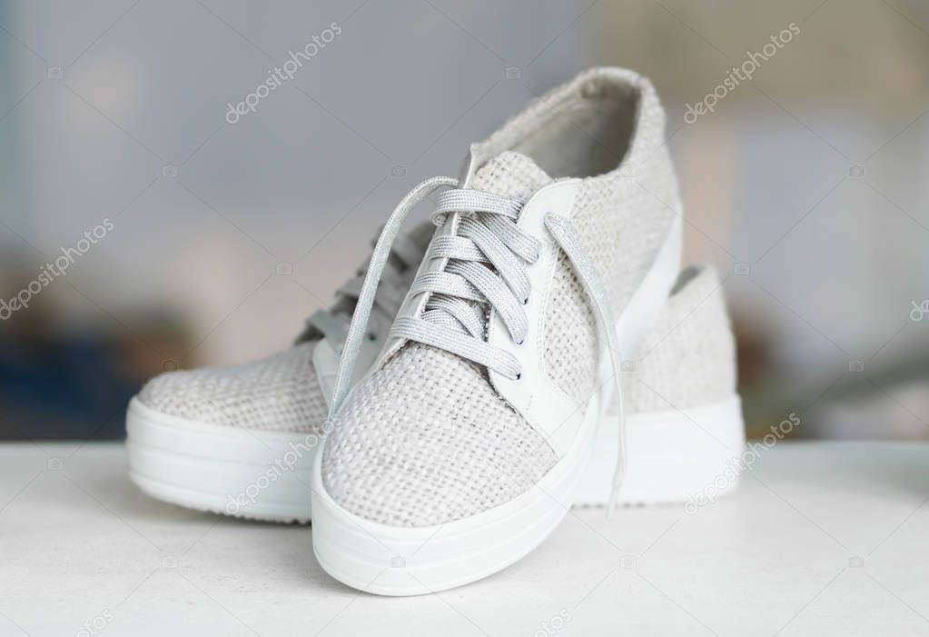 Handcrafted fashion shoes on blurry background