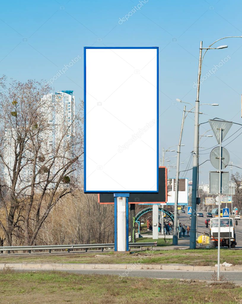 Blank vertical billboard near a highway. Background for mock-up.