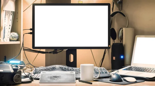 Blank screen of modern desktop computer. Workplace of stock photography artist.
