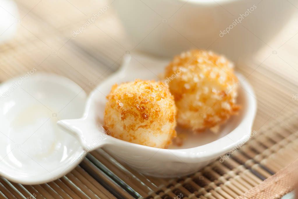 Fried rice balls close-up. Blurry cooking background