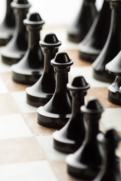 Confrontation concept. Chess figures on board close-up.