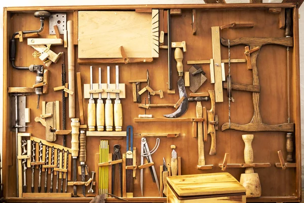 old carpenter\'s manual tools in an old carpentry shop