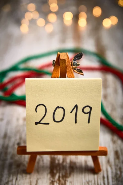 Easel Yellow Leaves Written New Year 2019 Wooden Table Next — Stock Photo, Image