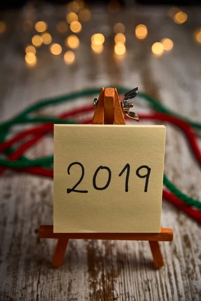 Easel Yellow Leaves Written New Year 2019 Wooden Table Next — Stock Photo, Image