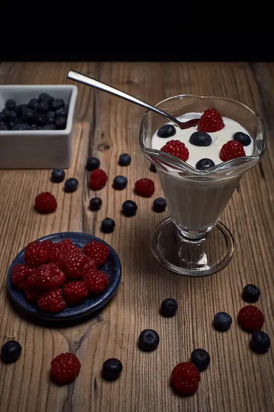 Glass Cup White Yogurt Fruits Raspberries Blueberries Old Table — Stock Photo, Image