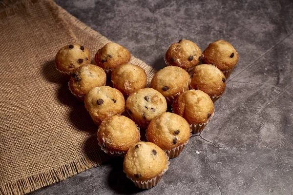 Group of delicious muffins with chocolate — Stock Photo, Image