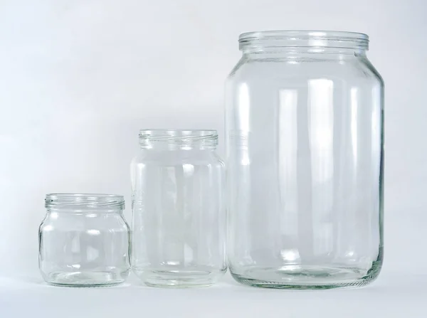 Three Empty Glass Jars Different Sizes Volumes Set Row White — Stock Photo, Image
