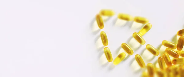 Medical drugs transparent capsules of yellow color — Stock Photo, Image