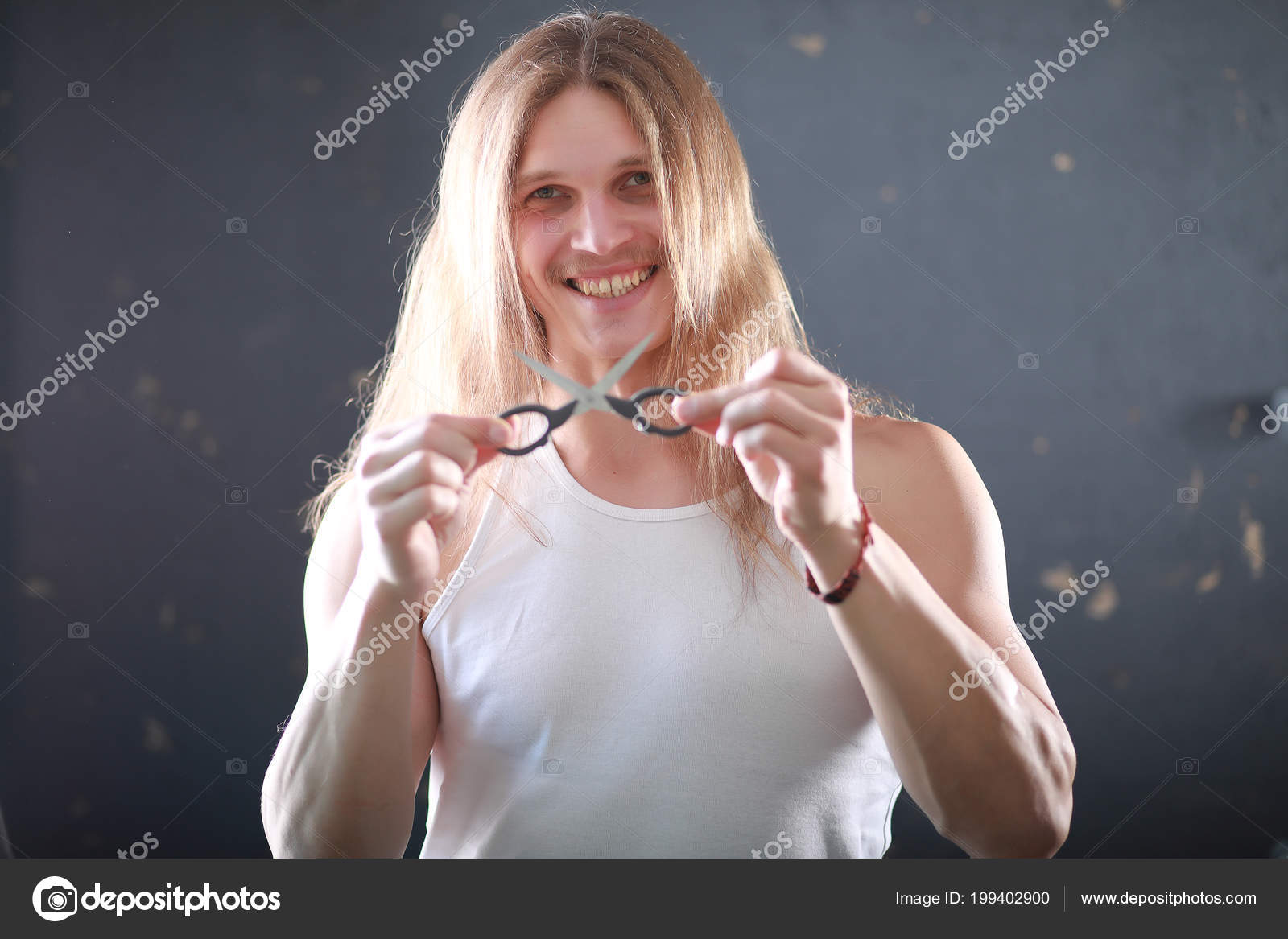 A Young Man With Long Hair Cut A Lock Stock Photo C Alexkich