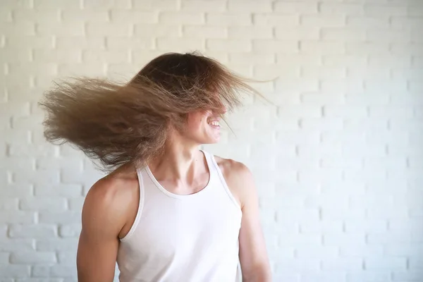 Young man with long hair