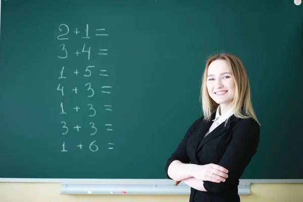 Young girl teacher in primary school — Stock Photo, Image