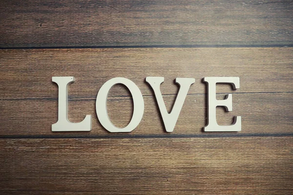 Palabra Amor de letras de madera sobre fondo — Foto de Stock