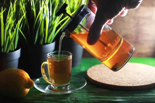 Brewing tea on a wooden table — Stock Photo, Image