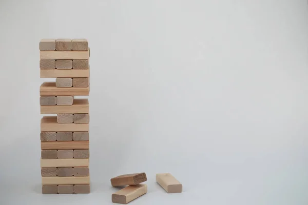 Board game jenga tower of wood sticks — Stock Photo, Image