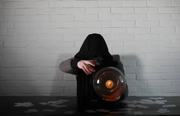 A man with a fortune teller ball — Stock Photo, Image