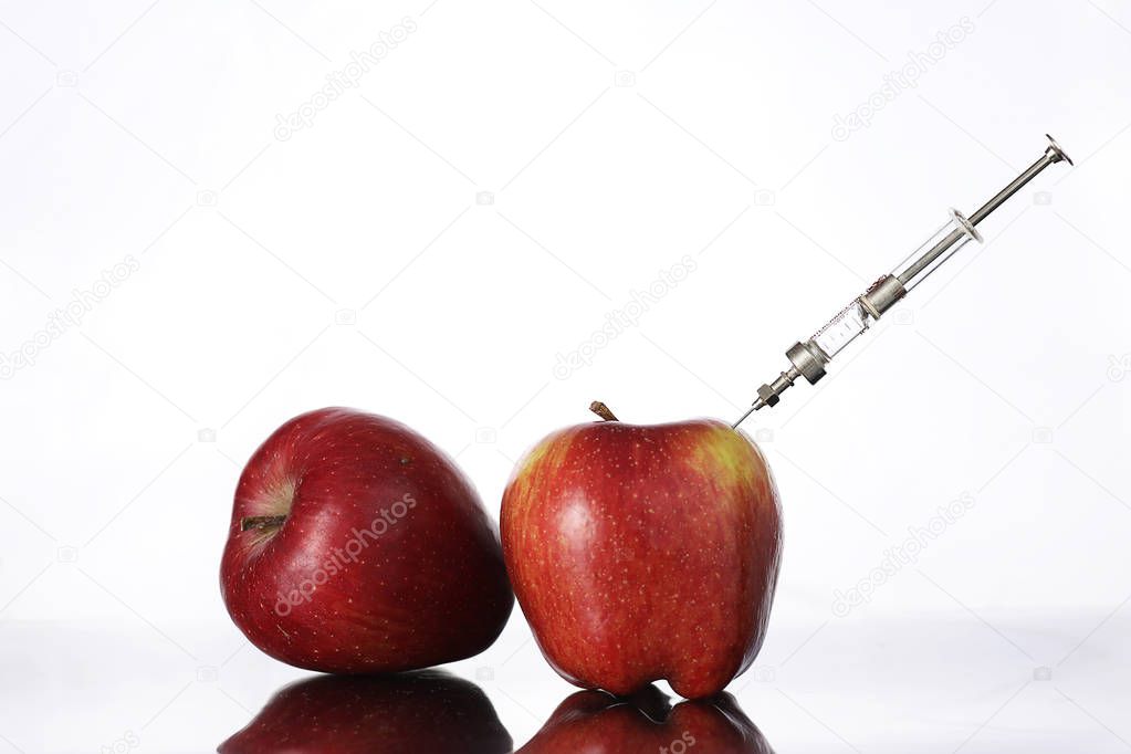 Genetically modified foods, apple pumped with chemicals