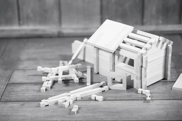 Toy wooden house. The constructor is made of natural wood for ch