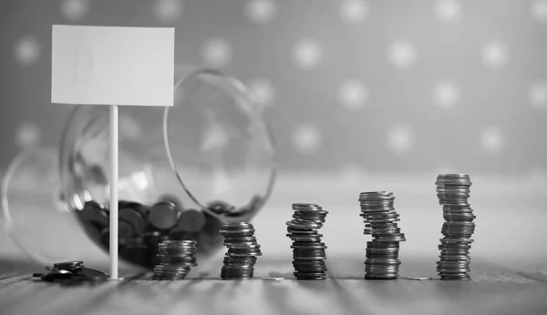 Coins in a jar on the floor. Accumulated coins on the floor. Sav Stock Photo