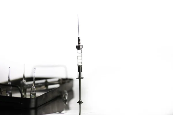 Old metal medical syringe and accessories on the table — Stock Photo, Image