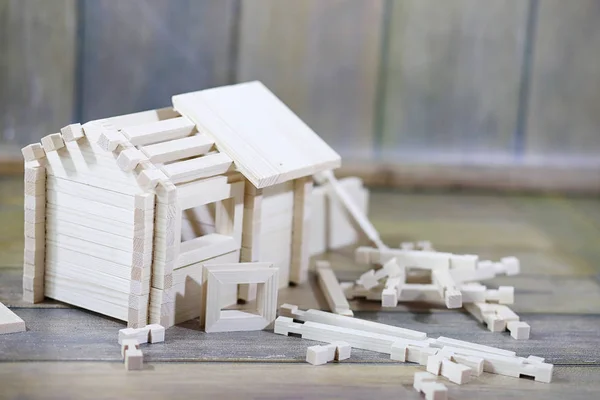 Toy wooden house. The constructor is made of natural wood for ch