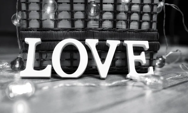 Word love made up of white wooden letters on a wooden background — Stock Photo, Image