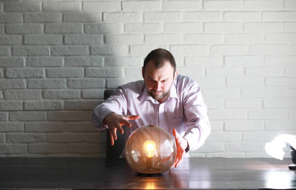 A man with a fortune teller ball
