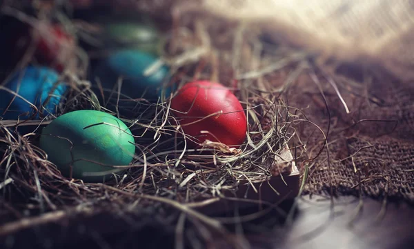 Easter painted eggs on burlap — Stock Photo, Image