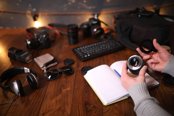 The photographers desk, digital camera accessories and lenses