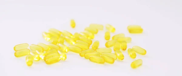 Medical drugs transparent capsules of yellow color — Stock Photo, Image