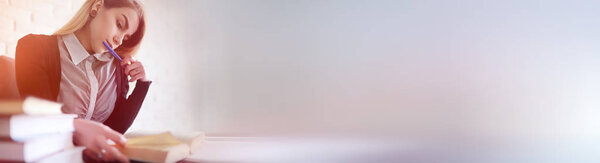 Young pretty blonde girl student