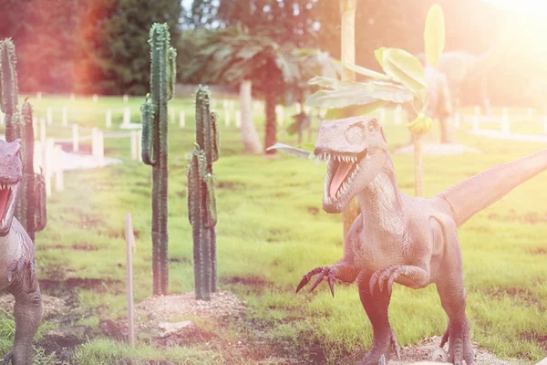 Park of dinosaurs. A dinosaur on the background of nature. Toy d — Stock Photo, Image