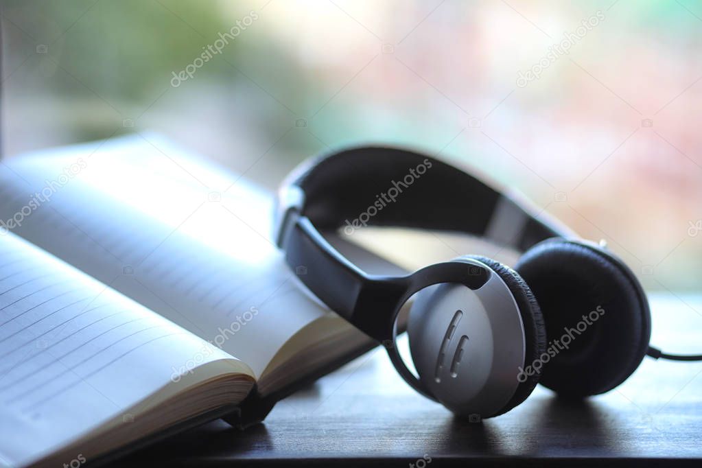 A stack of textbooks headphone