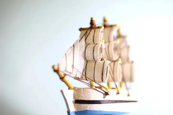 Old wooden ship with sails and masts toy on a stand. Vintage and — Stock Photo, Image