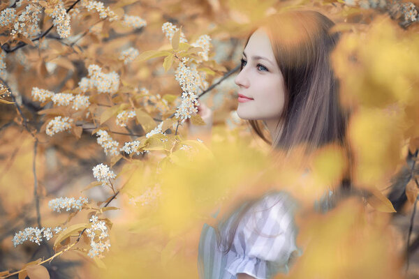 Young girl on a walk in the autumn park