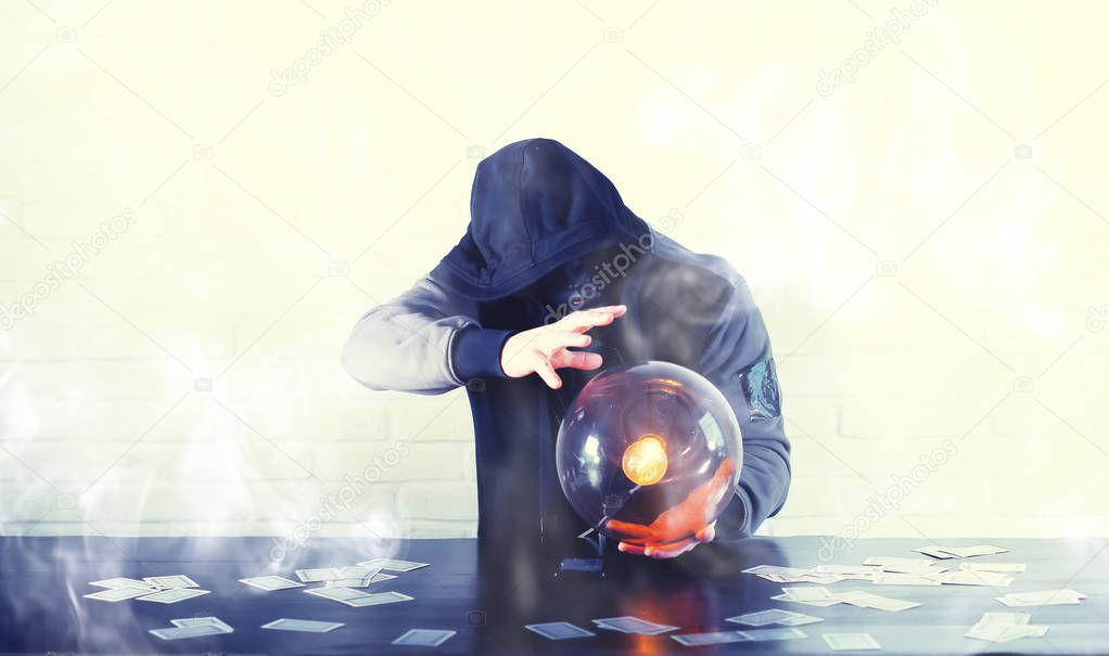 A man with a fortune teller ball
