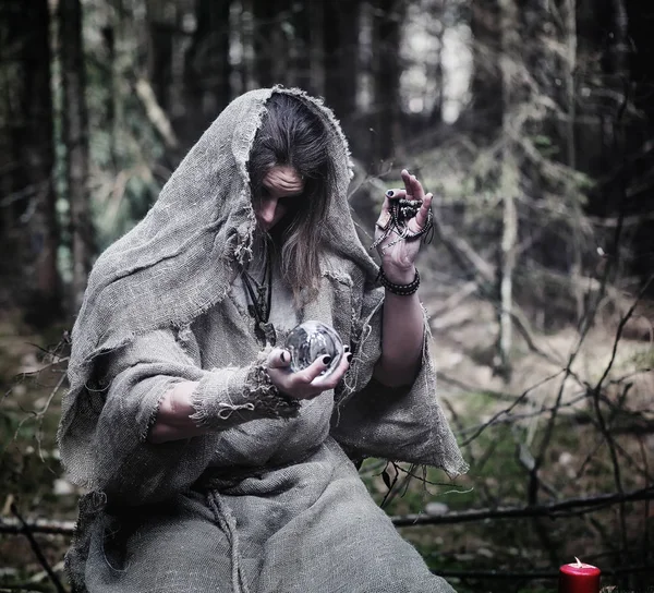 Fairy magician. A sorcerer with a glass sphere, a magical spell — Stock Photo, Image