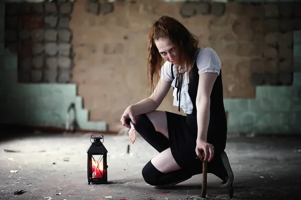 A young girl in the blood and with a knife Royalty Free Stock Photos