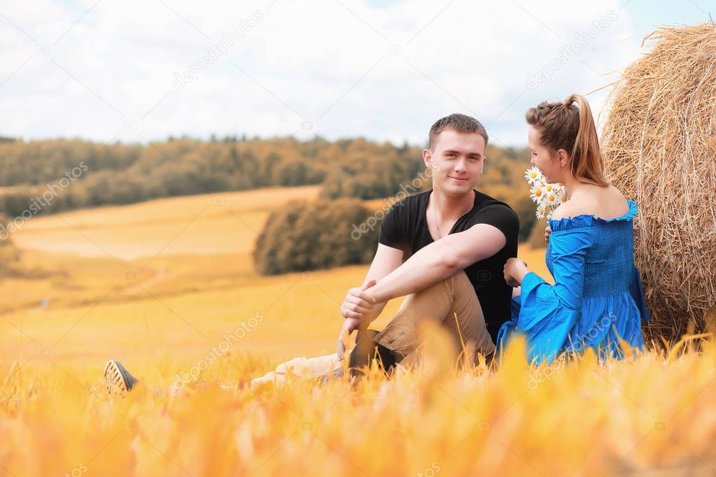 Couple on a walk in the country fields 