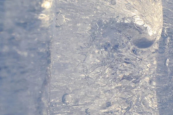 Texture of ice in winter. Pieces of frozen water on a street in — Stock Photo, Image