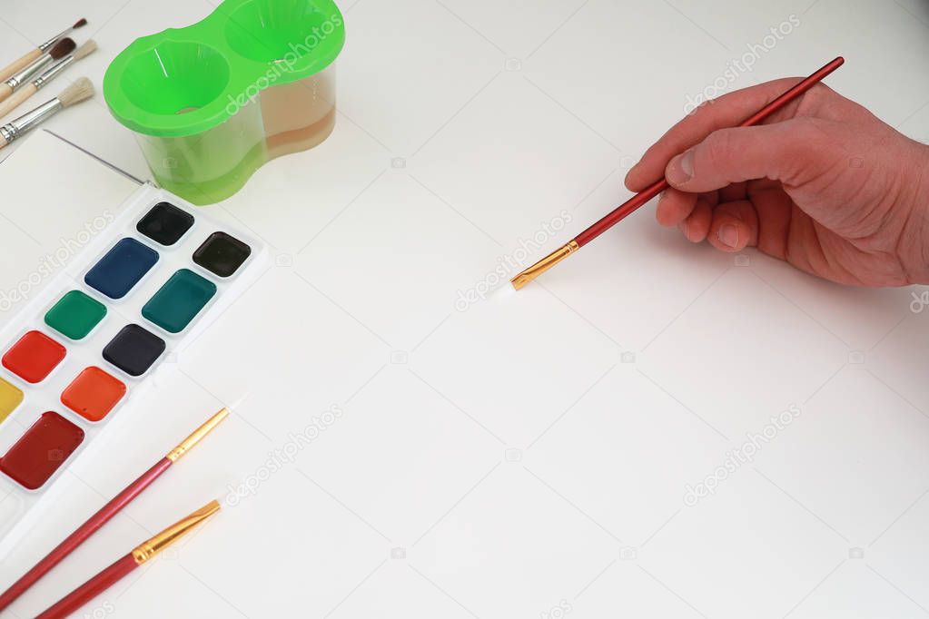 Drawing paints on a white sheet of paper