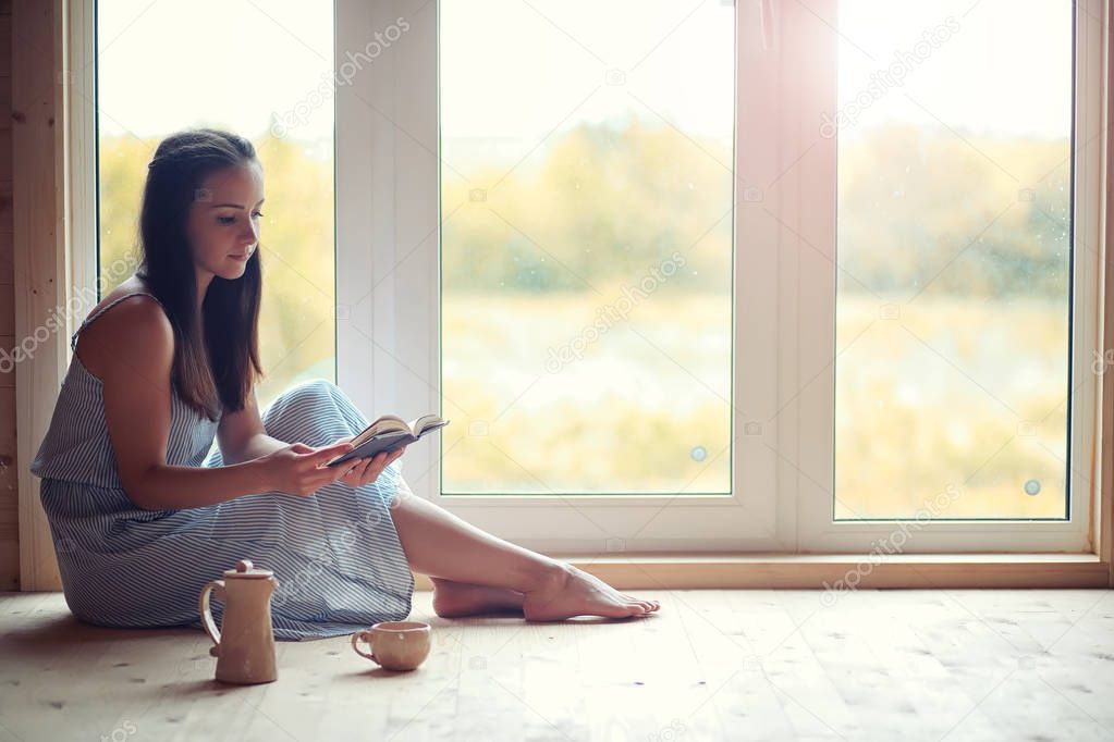 A girl at the window in the house