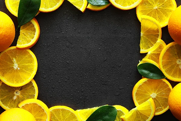 Orange citrus fruit on stone table. Orange background.