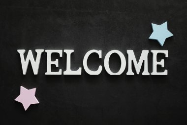 Arka plan konsepti. Yazıt Karanlık bir arka plan üzerinde Hoşgeldiniz.