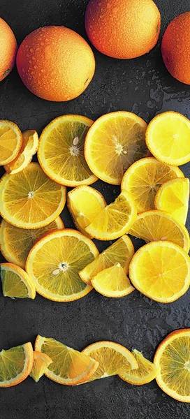 Orange citrus fruit on stone table. Orange background.