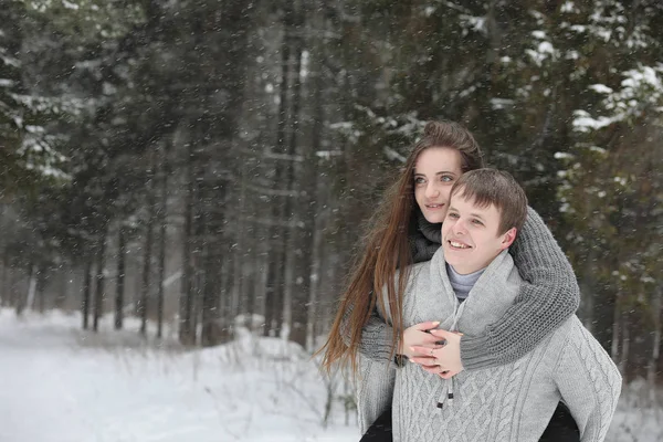 Pair of lovers on a date winter afternoon in a snow blizzard — Stock Photo, Image