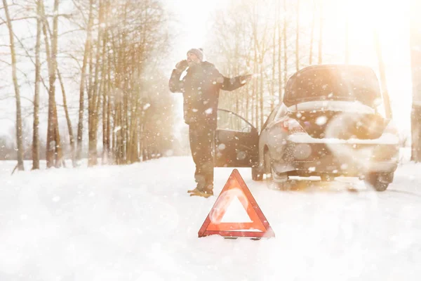 Man and car. Winter walk and car repair. — Stock Photo, Image